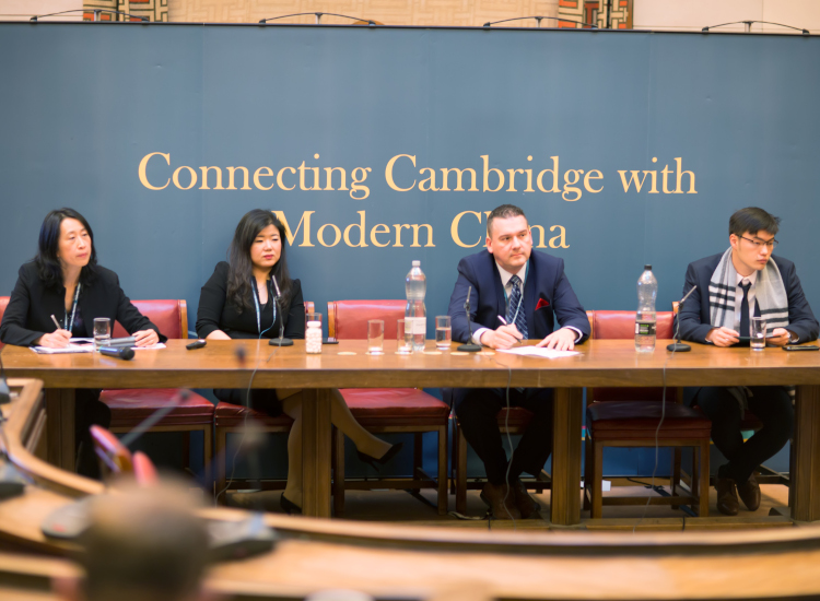 Four panelist in the Council Chamber at the Cambridge China Forum