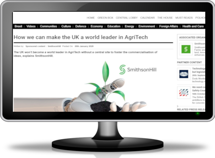 Computer monitor showing Robot hand and article about agritech